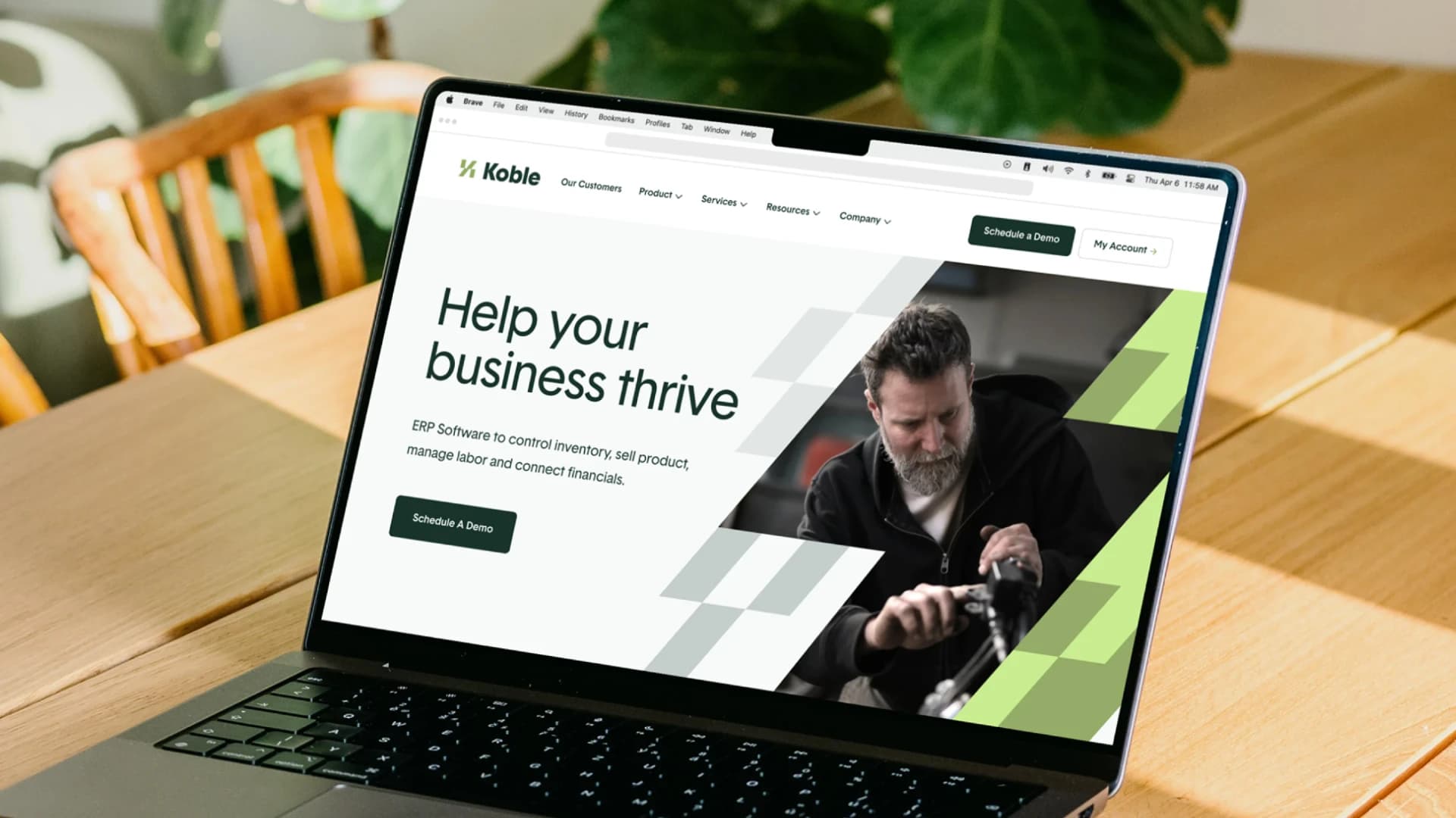 The Koble website on a laptop, with its green identity and Help your business thrive message.