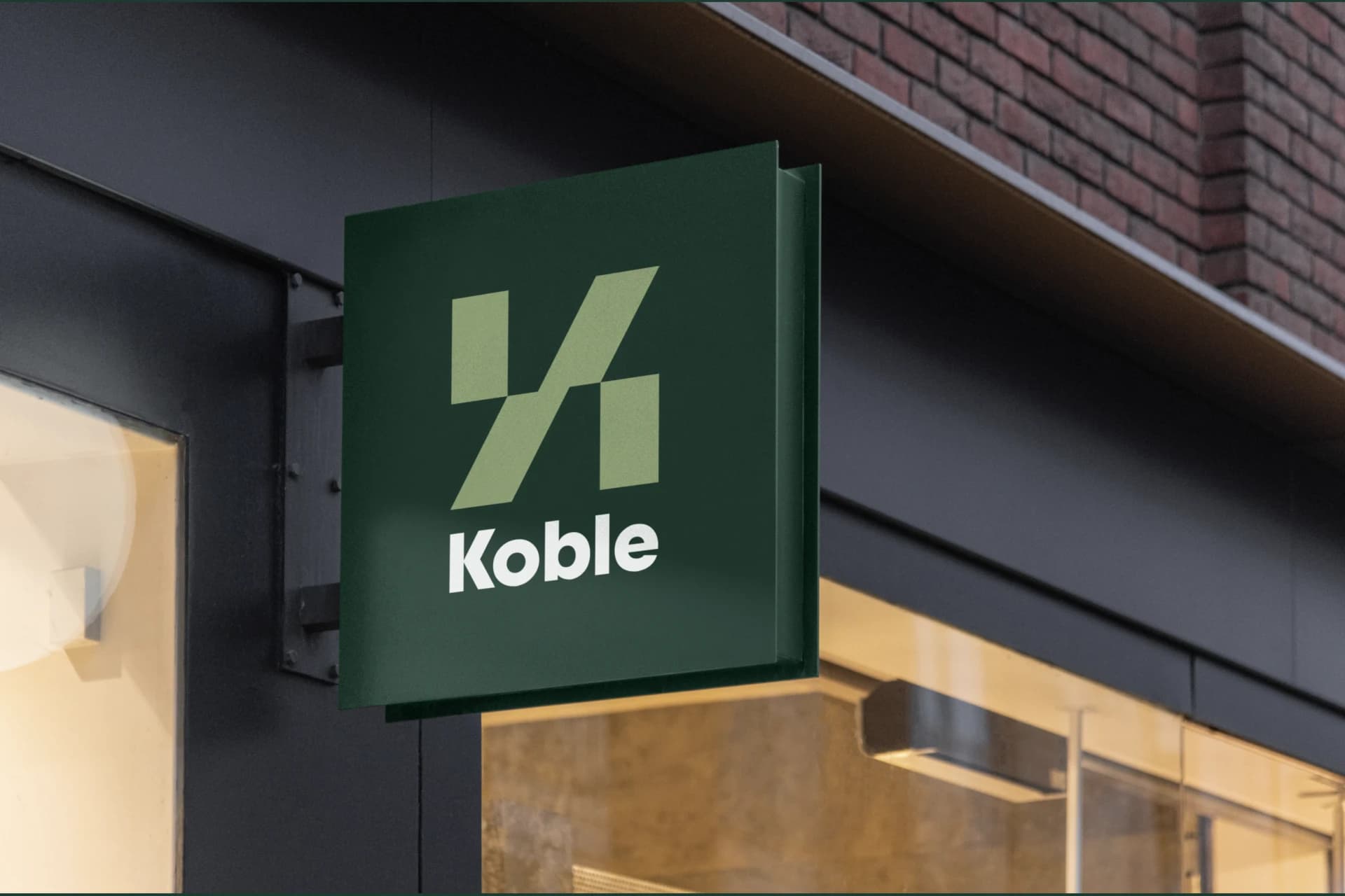 Koble’s interlocking mark on a hanging sign.