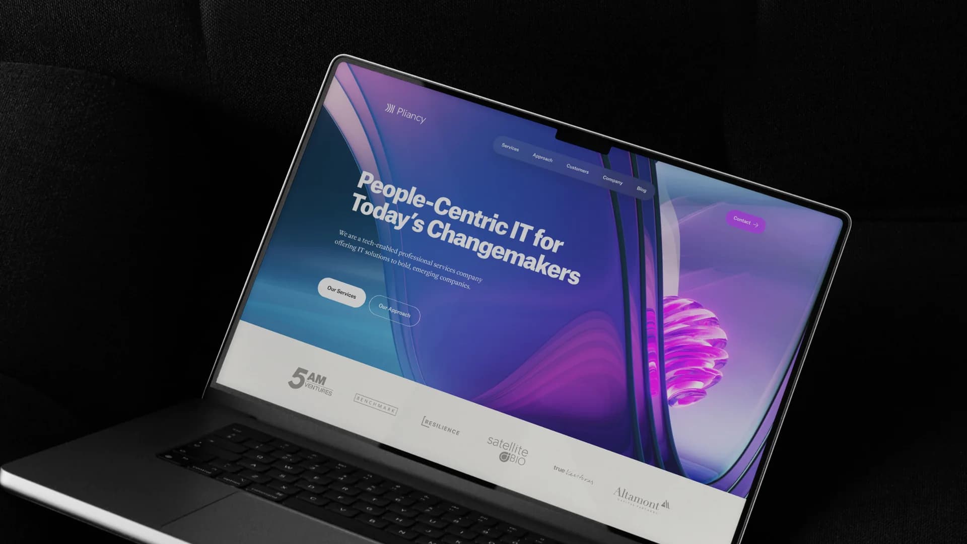 Pliancy’s website on a laptop, pairing a people-centric message with vivid purple dimensional artwork.